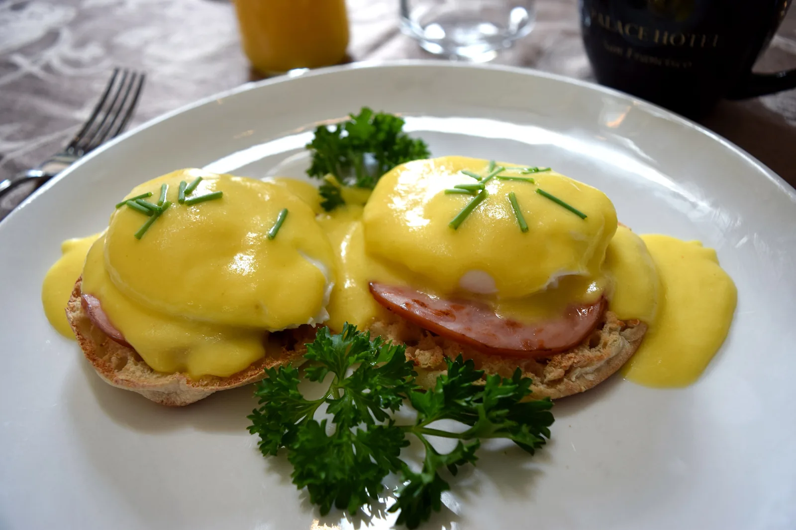Eggs Benedict with Canadian bacon and hollandaise on an English muffin.