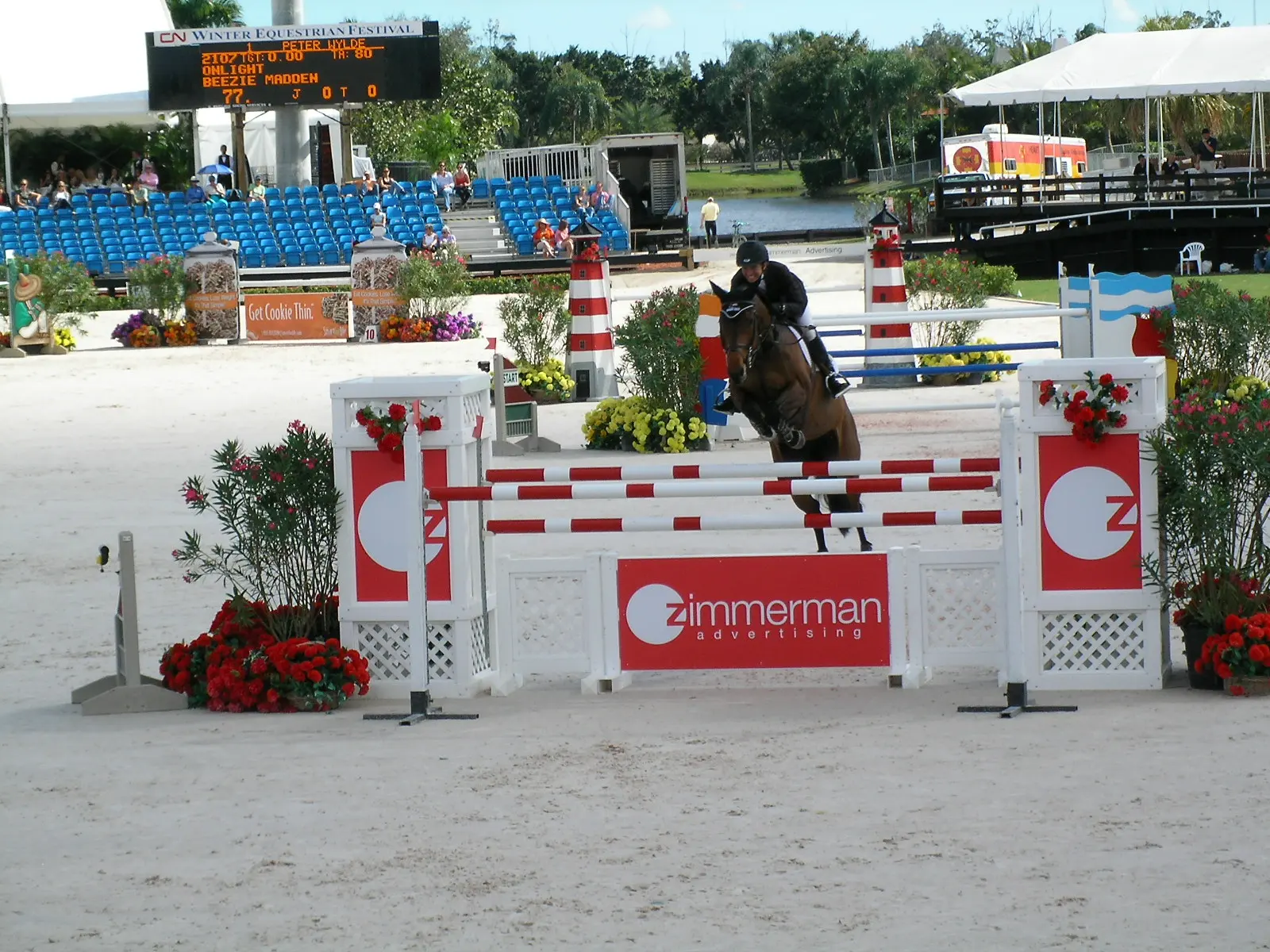 A show jumper clears a fence in a grand prix at the Winter Equestrian Festival in Wellington.