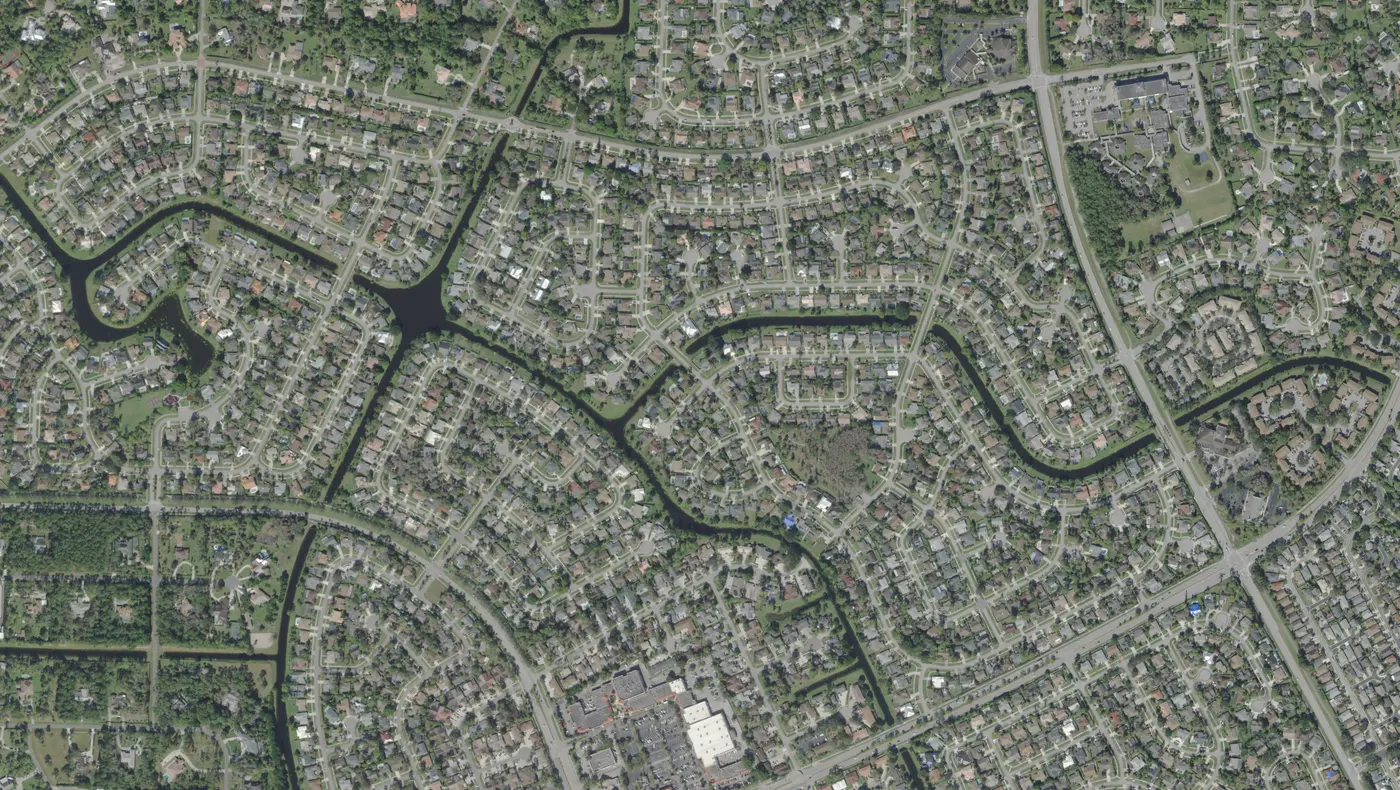 Streets of single-family homes, canals and Big Blue Trace in the northern part of Wellington, in a USDA aerial photograph from 2022.