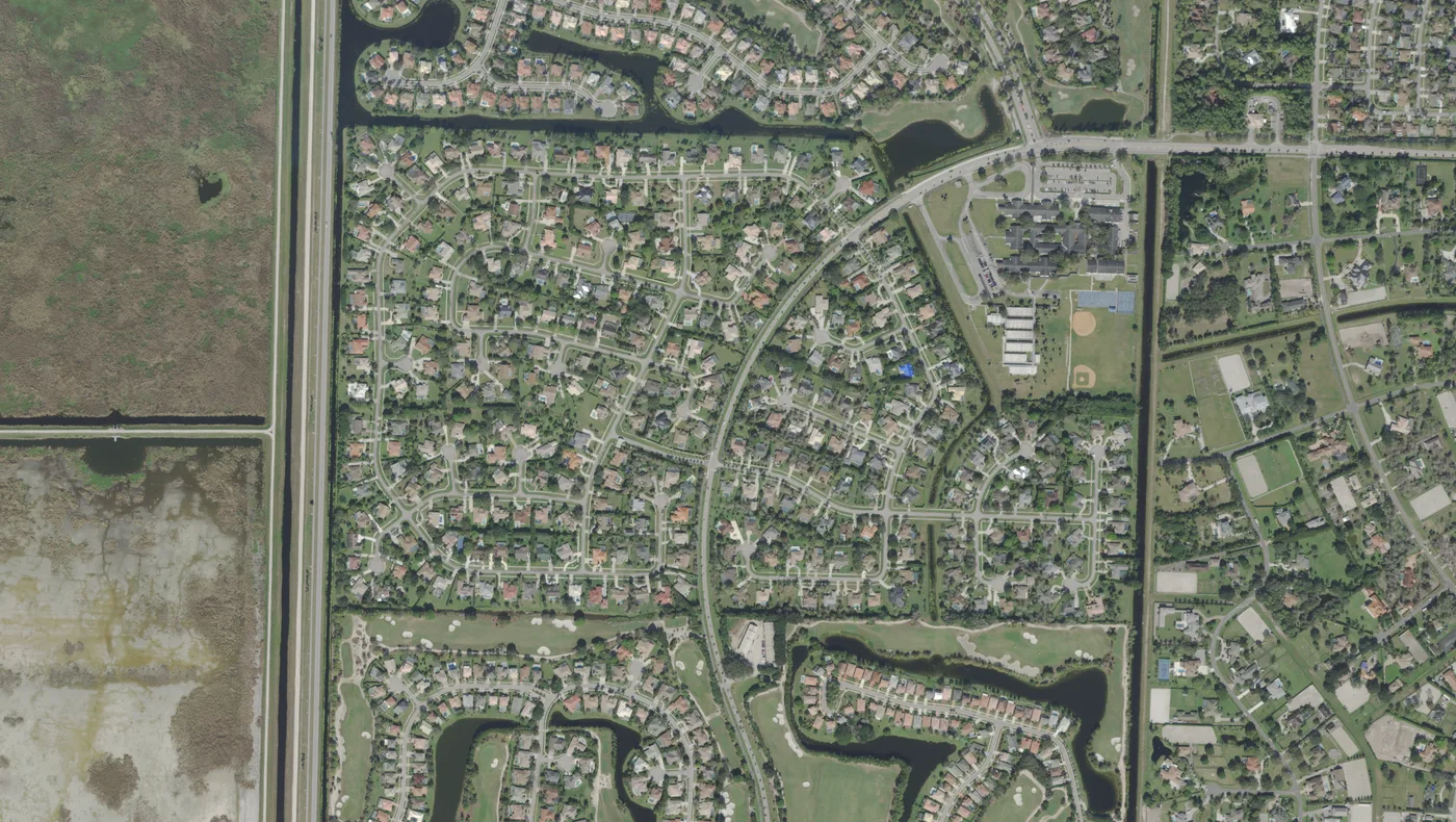 Binks Forest, the Landings communities and the canal along Wellington's western edge, with a school campus on Greenbriar Boulevard, in a USDA aerial photograph from 2022.