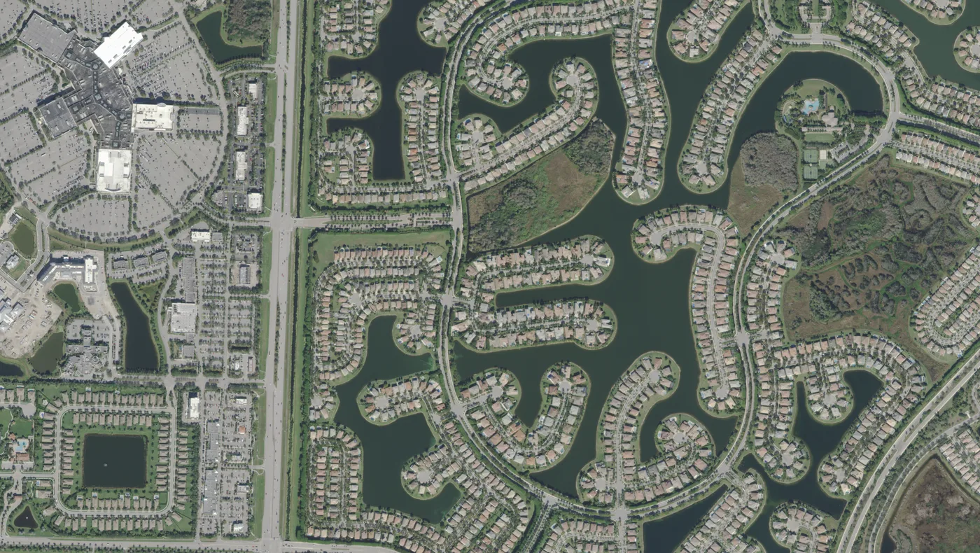 The lakes and curving streets of Olympia, east of State Road 7 in Wellington, with the Mall at Wellington Green at the far left, in a USDA aerial photograph from 2022.