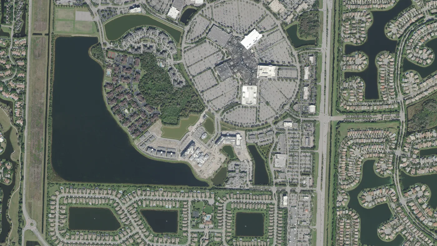 The Mall at Wellington Green, its lake and the homes south of it, with State Road 7 running north to south, in a USDA aerial photograph from 2022.