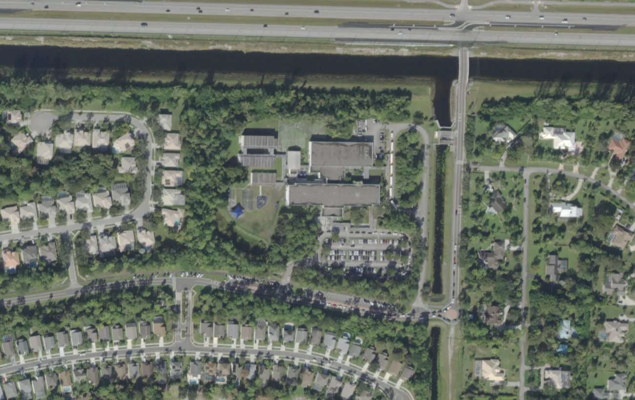 Binks Forest Elementary on Bent Creek Road in Wellington from the air, with homes on both sides of the campus