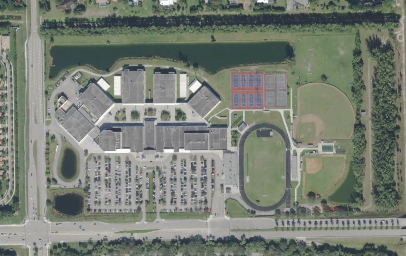 Palm Beach Central High School's campus on Forest Hill Boulevard in Wellington from the air, with its stadium, ball fields and tennis courts