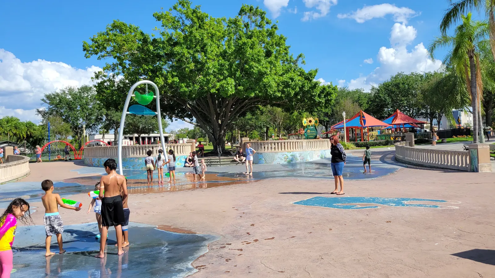 Children play in the splash pad at Barnett Family Park in Lakeland, Florida.
