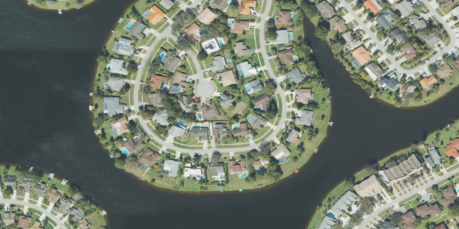 Homes on the lakes of Lakeside Shores, Wellington, seen from the air.