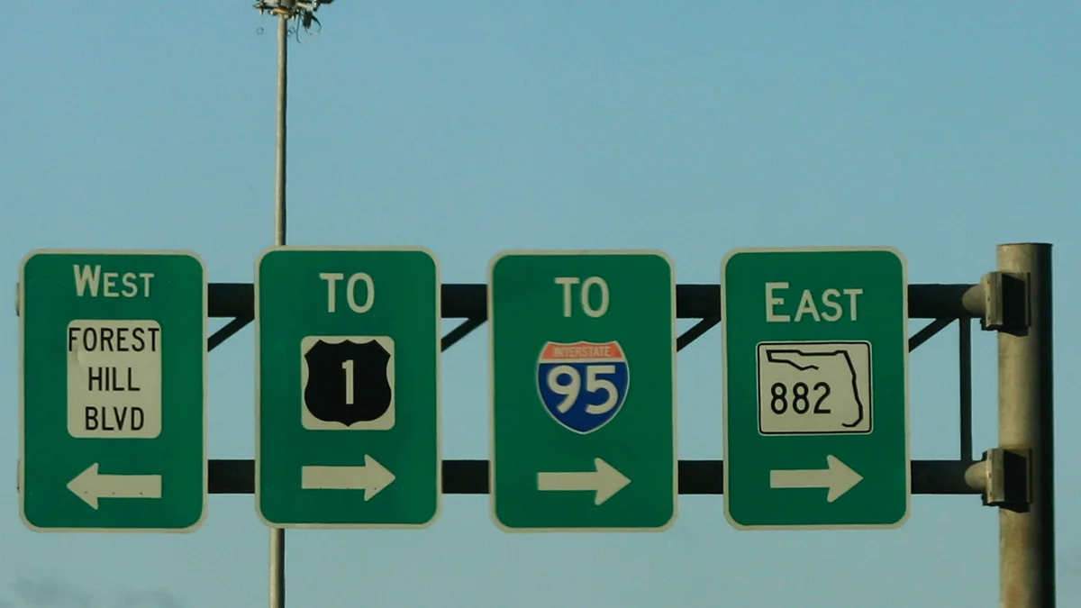 Overhead signs for Forest Hill Boulevard (State Road 882) on U.S. 441, the road that runs along Wellington's eastern edge toward Greenacres and Royal Palm Beach.
