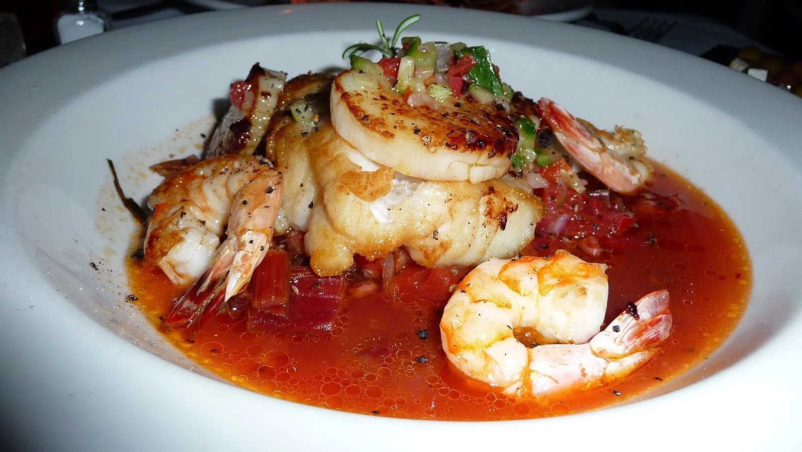Seared fish, scallops and shrimp in a tomato broth. The photo was not taken at a Wellington restaurant.